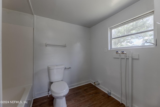 bathroom with toilet and hardwood / wood-style flooring