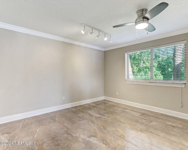 spare room with a textured ceiling, crown molding, ceiling fan, and rail lighting