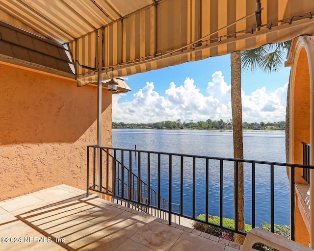 balcony featuring a water view