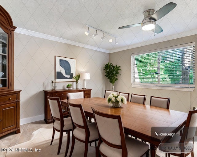 dining space featuring ornamental molding, tile walls, rail lighting, and ceiling fan