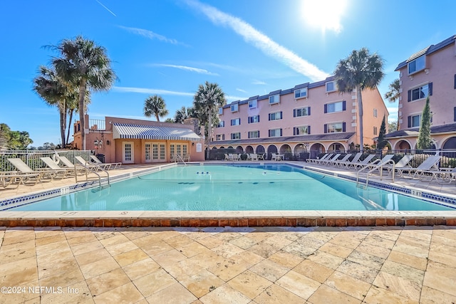 view of swimming pool with a patio area