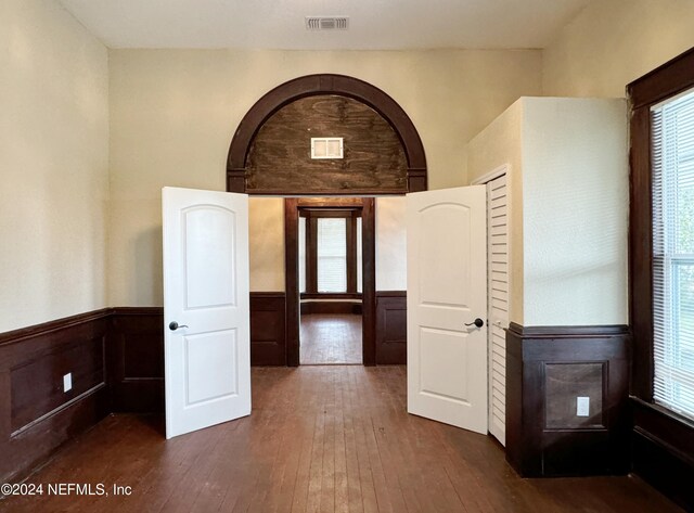 empty room featuring dark hardwood / wood-style flooring