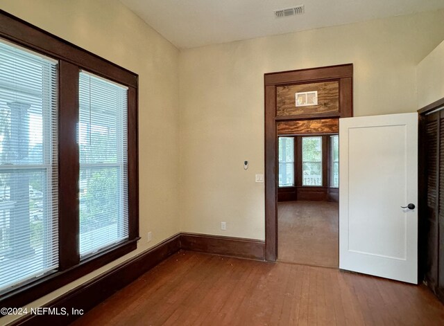 spare room with wood-type flooring