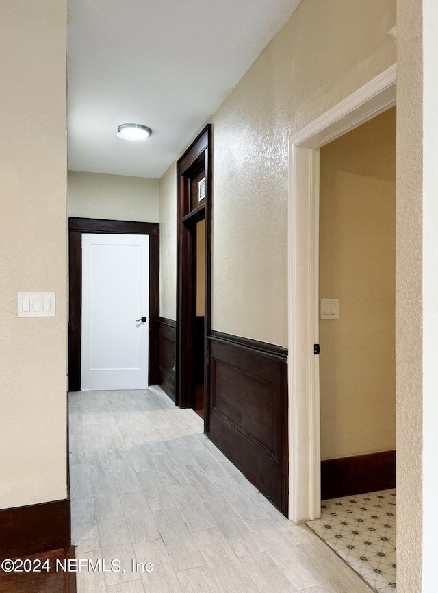 hall with light hardwood / wood-style flooring