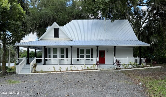 farmhouse-style home featuring a porch