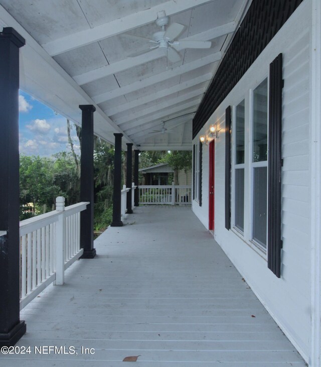 deck with ceiling fan and a porch