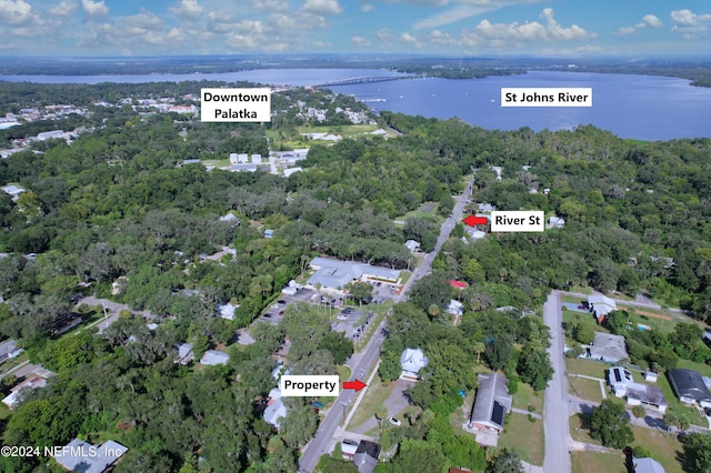 birds eye view of property featuring a water view