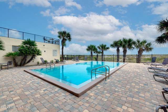 view of pool with a patio area