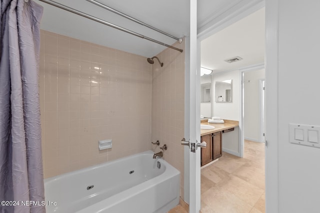 bathroom featuring vanity and shower / tub combo