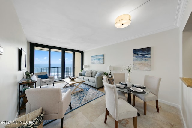 living room featuring a water view, floor to ceiling windows, and ornamental molding