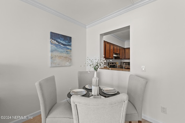 dining room with ornamental molding