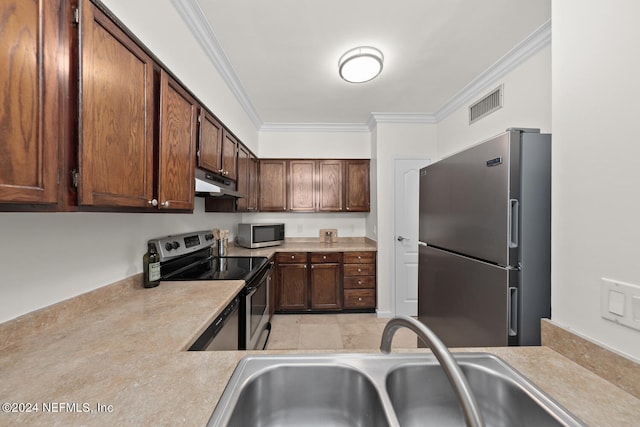 kitchen featuring appliances with stainless steel finishes, light tile patterned floors, ornamental molding, and sink