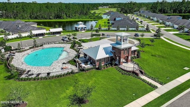 birds eye view of property with a water view and a residential view