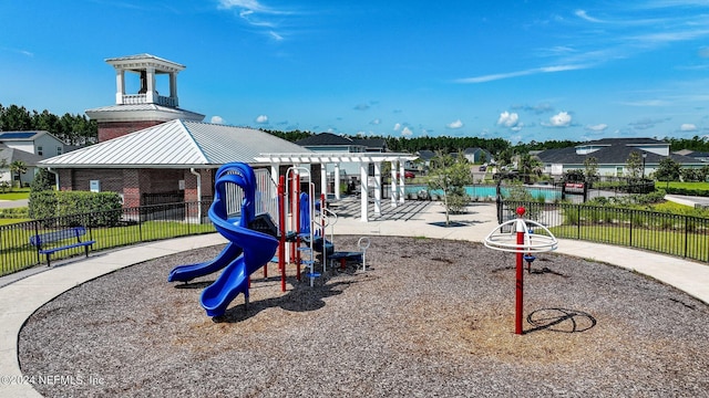 community playground with fence and a pergola