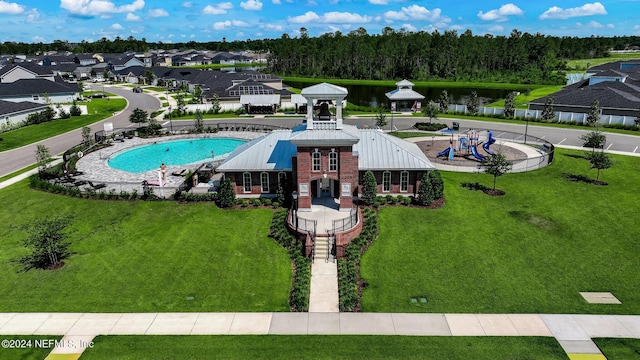 view of swimming pool with a residential view, a lawn, a gazebo, and fence