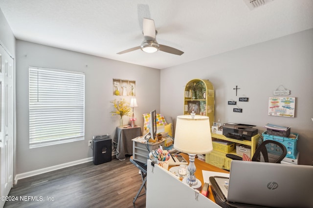 office area with baseboards, ceiling fan, visible vents, and wood finished floors