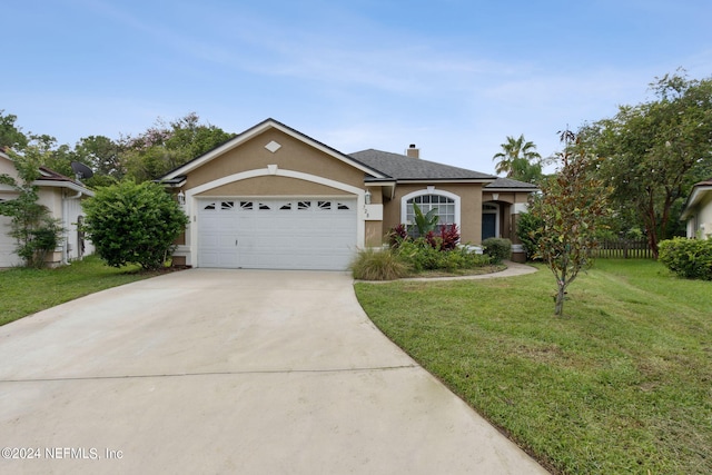 ranch-style house with a garage and a front lawn