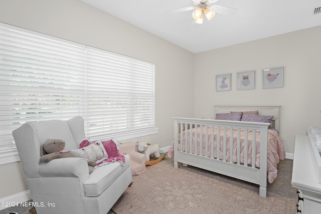 bedroom with visible vents, ceiling fan, and baseboards