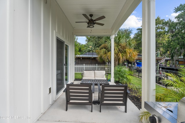 view of patio featuring outdoor lounge area, ceiling fan, and fence