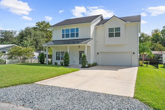 modern inspired farmhouse featuring a garage, concrete driveway, fence, board and batten siding, and a front yard