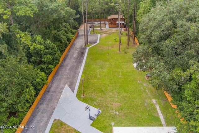 birds eye view of property with a view of trees