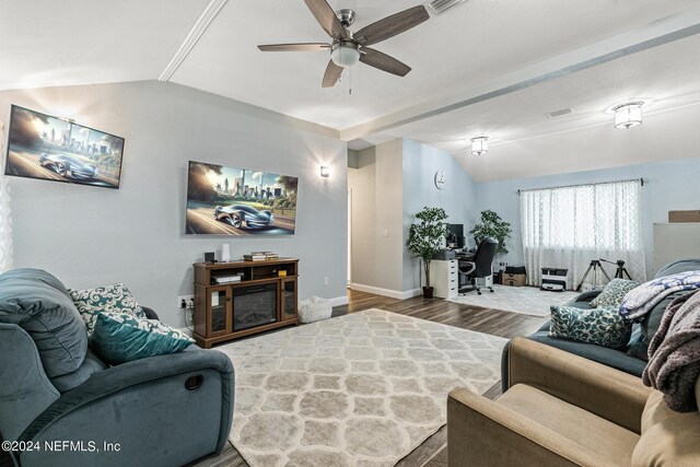 living room with lofted ceiling, hardwood / wood-style floors, and ceiling fan