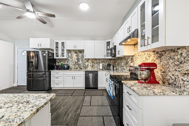 kitchen featuring black appliances, light stone countertops, ceiling fan, decorative backsplash, and white cabinets