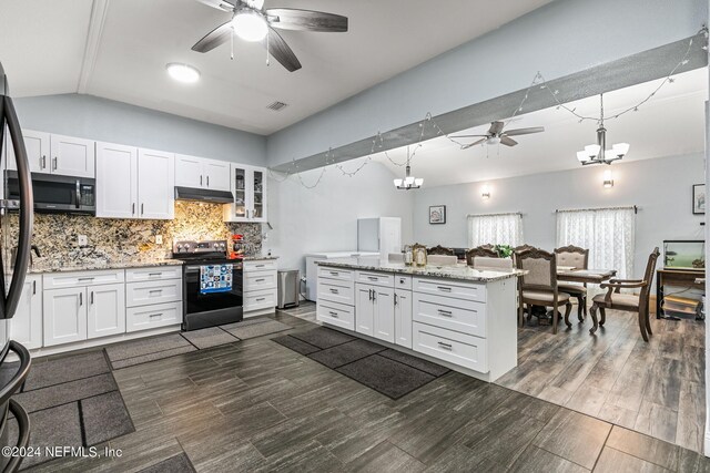 kitchen with ceiling fan with notable chandelier, appliances with stainless steel finishes, dark hardwood / wood-style flooring, and white cabinets