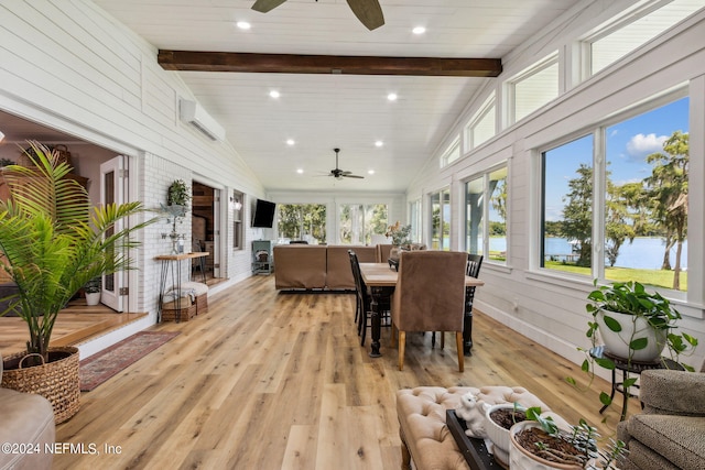 sunroom featuring wooden ceiling, lofted ceiling with beams, an AC wall unit, and ceiling fan