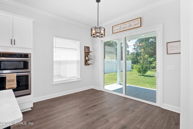 kitchen featuring white cabinetry, dark hardwood / wood-style flooring, and a healthy amount of sunlight