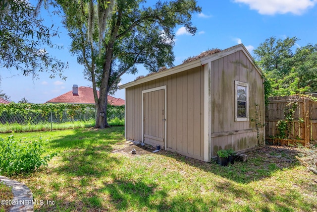 view of shed featuring a fenced backyard