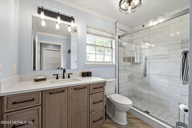 bathroom featuring crown molding, vanity, toilet, and walk in shower