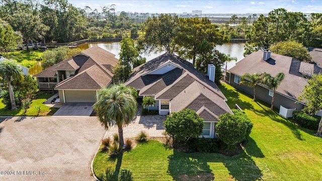 birds eye view of property featuring a water view