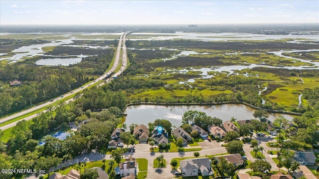 drone / aerial view with a water view