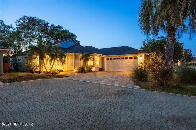 view of front of property with a garage