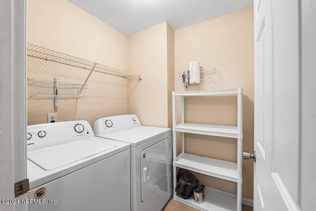 clothes washing area featuring washing machine and dryer