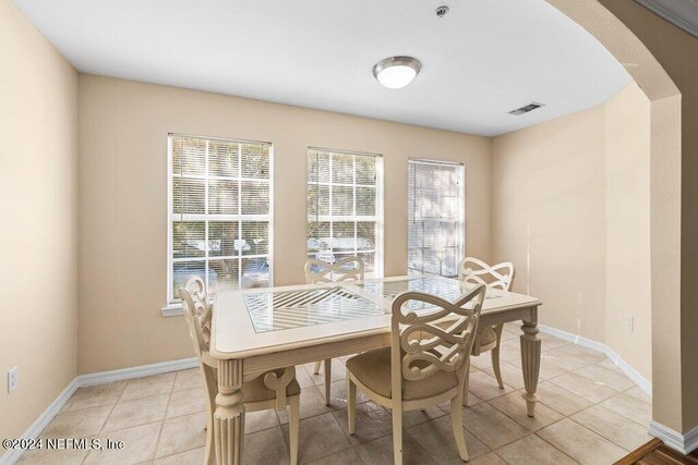 dining room with light tile patterned flooring