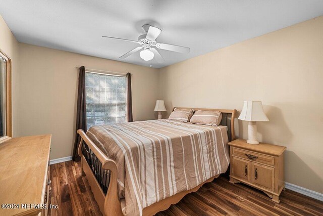 bedroom featuring dark hardwood / wood-style floors and ceiling fan