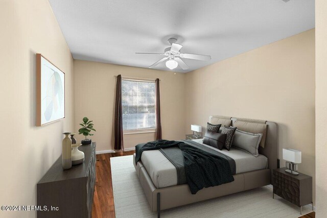 bedroom featuring ceiling fan and hardwood / wood-style floors