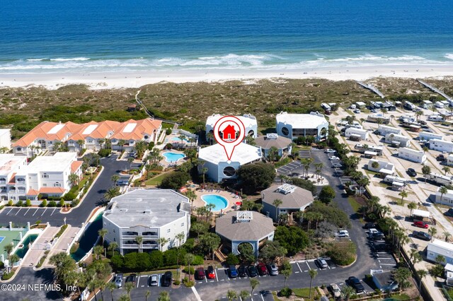 aerial view featuring a water view and a beach view