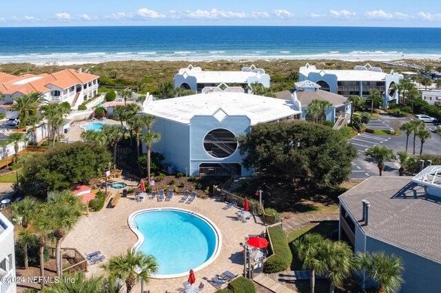 aerial view featuring a view of the beach and a water view