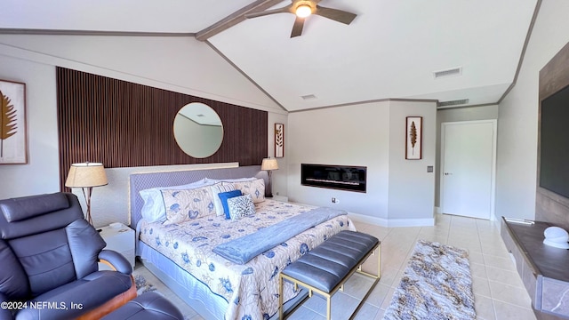 bedroom featuring lofted ceiling with beams, ceiling fan, and light tile patterned floors