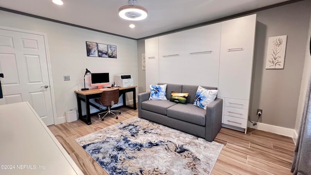 office space featuring ornamental molding and light hardwood / wood-style floors