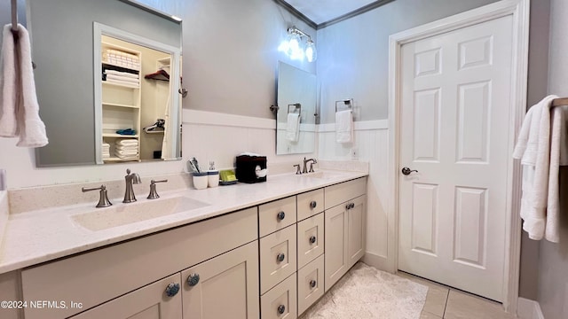 bathroom with tile patterned floors and vanity