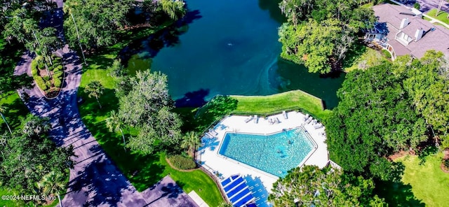 birds eye view of property with a water view