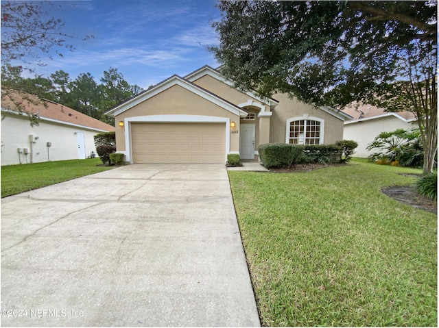 ranch-style home with stucco siding, an attached garage, driveway, and a front lawn