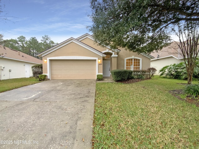 ranch-style home featuring a front yard, a garage, driveway, and stucco siding