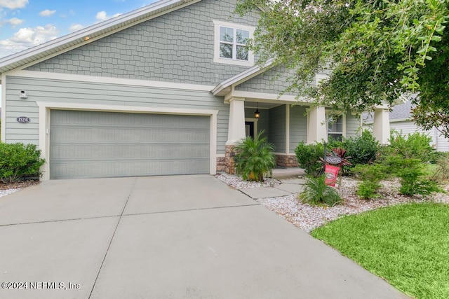 craftsman inspired home featuring concrete driveway