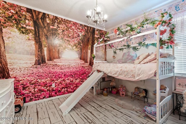 bedroom with a chandelier and crown molding