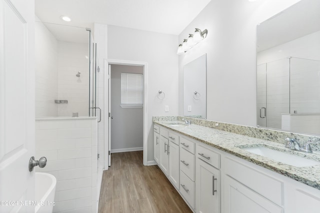 5231 Peggy Ln, Middleburg, FL 32068 - bathroom featuring wood finished floors, a sink, double vanity, and a stall shower